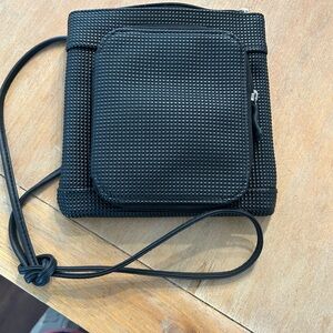 Urban oxide Black rubber Textured Crossbody Bag. Made of recycled material.